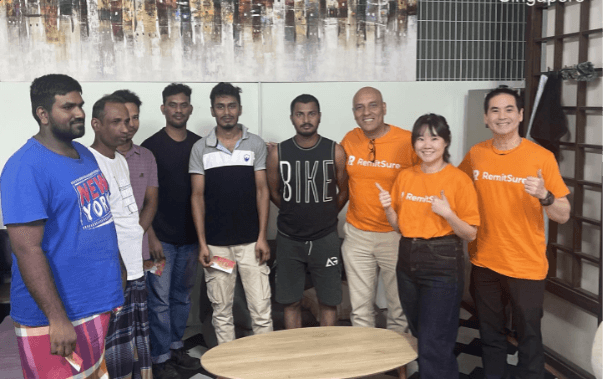 EFGH leadership Manoj Chaman Lal, Teh Yun Ying, and Dixon Ong conducting user research with migrant workers in Singapore.