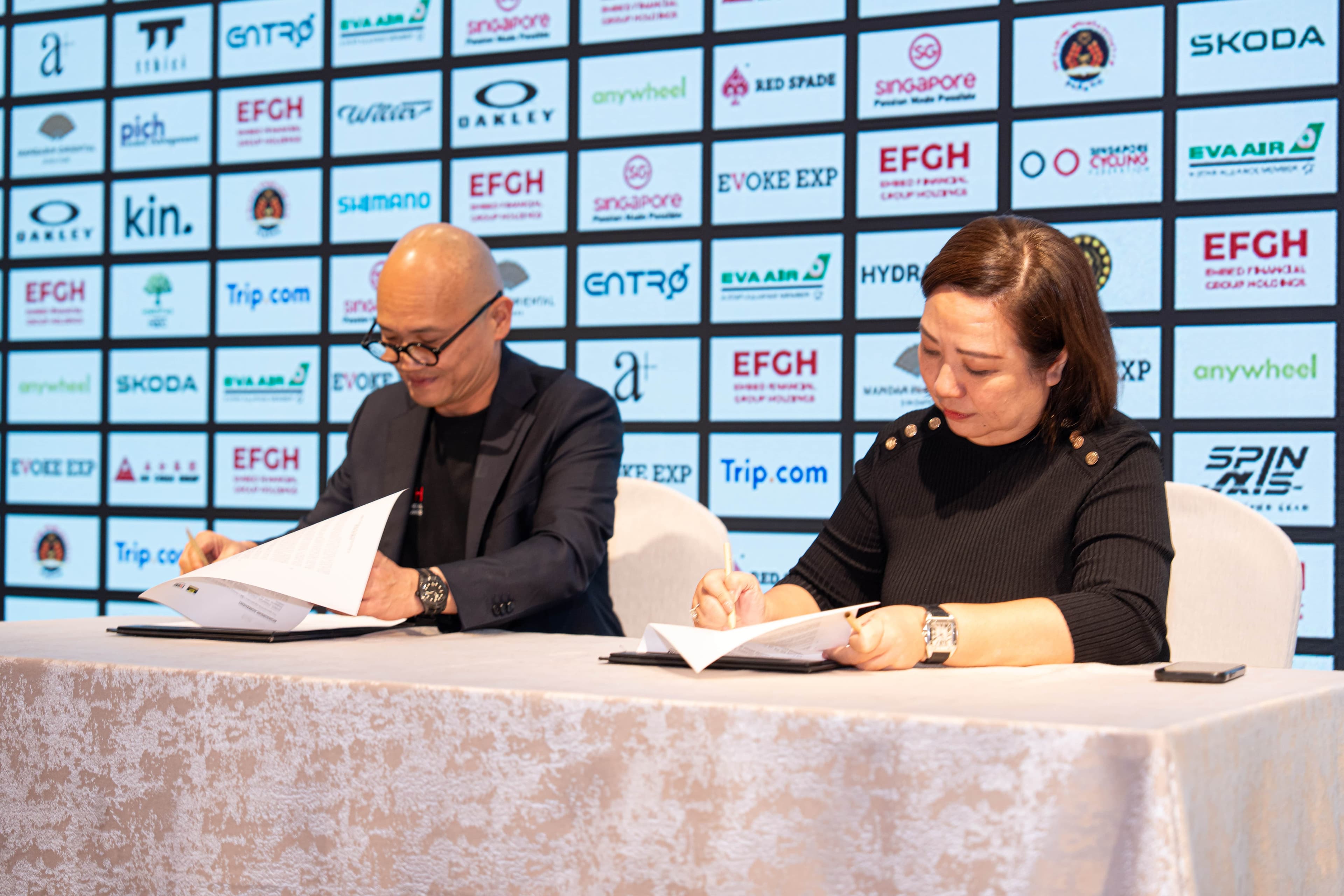 Dennis Ng and Agnes Goh ink the Title Sponsorship Agreement at the Tour De France EFGH Singapore Criterium 2025 Signing Ceremony at Mandarin Oriental